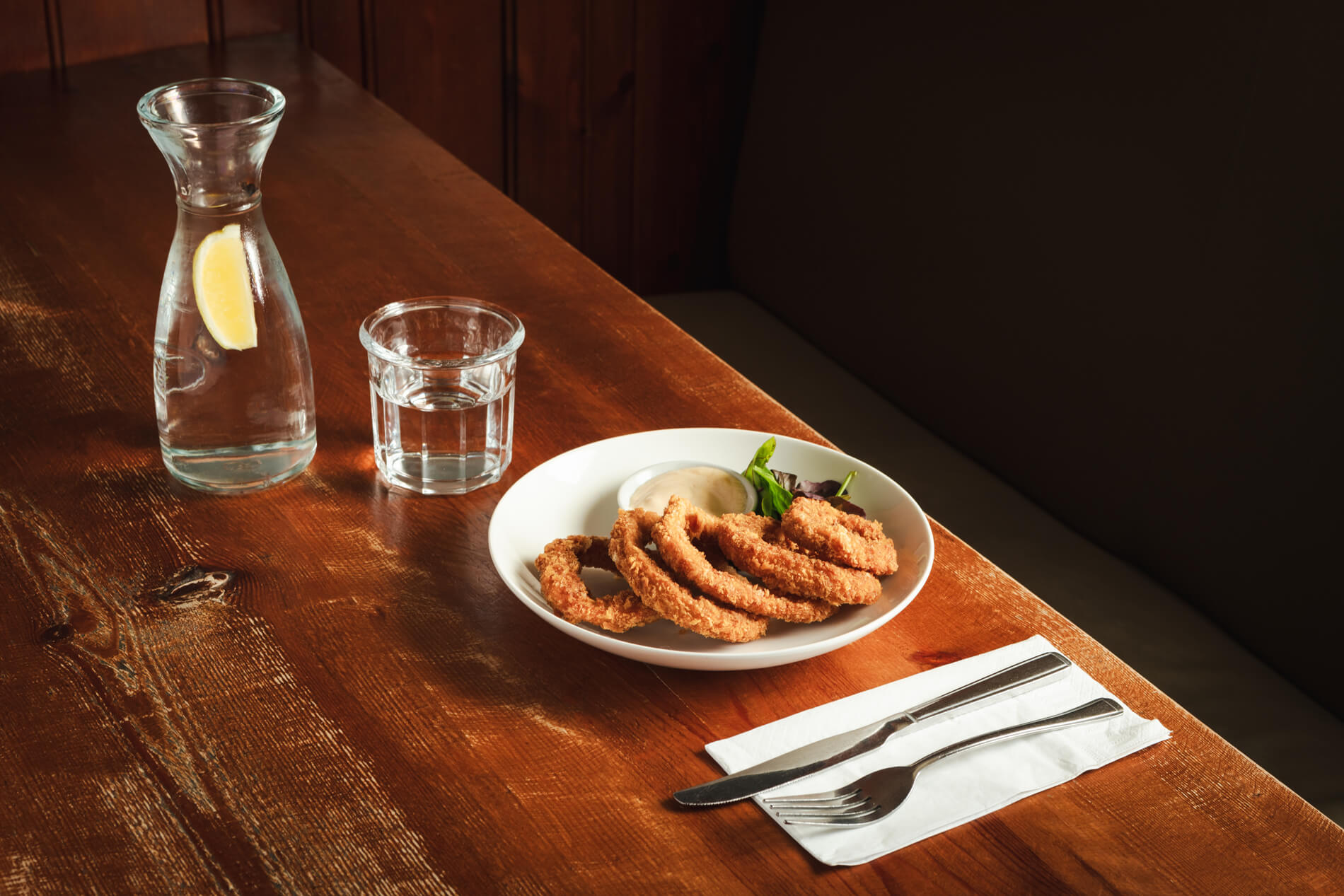 Squid rings with water and cutlery